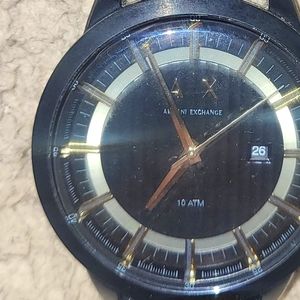 Armani exchange watch black and gold face with a leather band